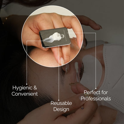DLUX reusable palette held on the hand during a lash treatment